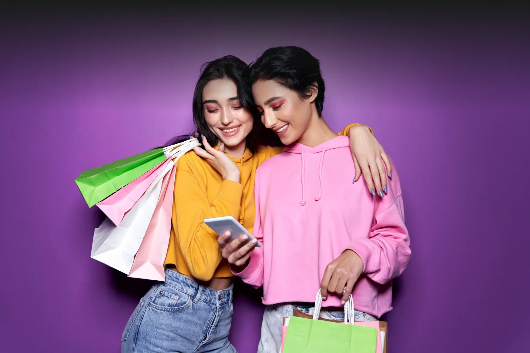 Two friends with shopping bags